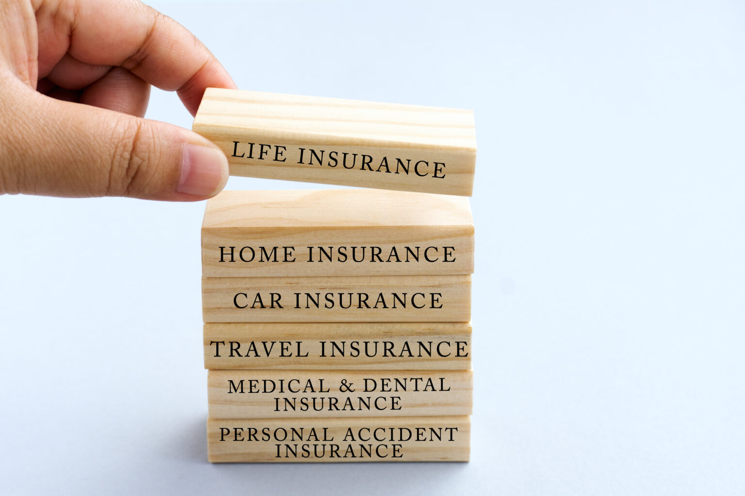 Hand,Picking,Wood,Block,With,Word,<b>Life</b>,Insurance.,Business,Concept.